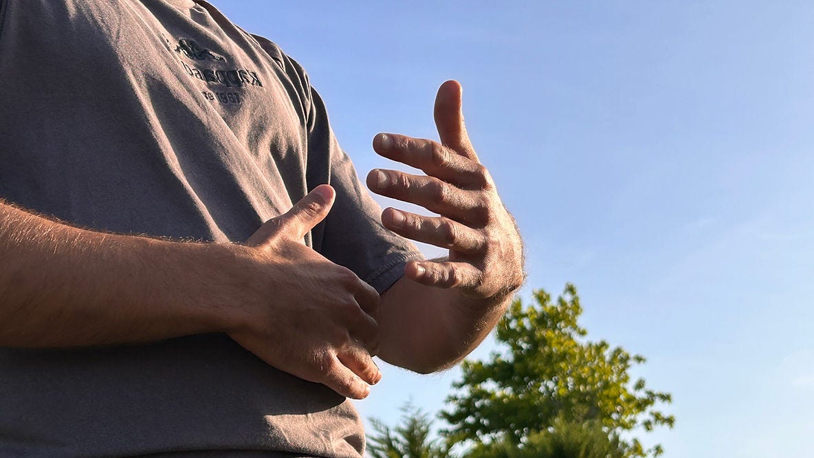 a man connecting to energy of the sun