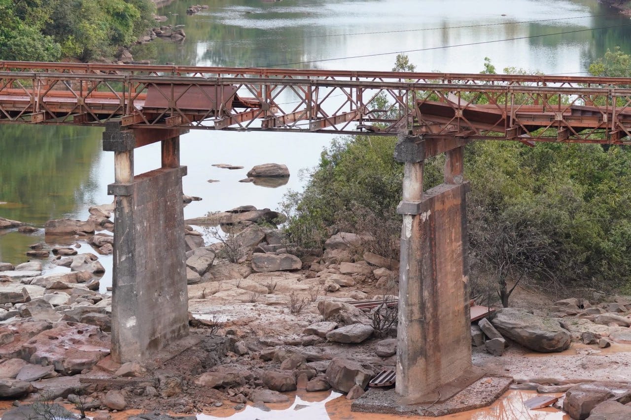 A collapsed bridge in a Cambodian border area, showing visible structural damage after reported shelling along the Cambodia–Thailand border. A collapsed bridge in a Cambodian border area, showing visible structural damage after reported shelling along the Cambodia–Thailand border.