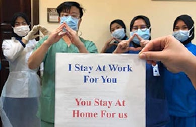 covid propaganda i stay at work for you you stay at home for us