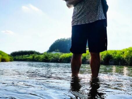A man walking in the river, river play, outdoor, to enter the water, JPG A man walking in the river, river play, outdoor, to enter the water, JPG