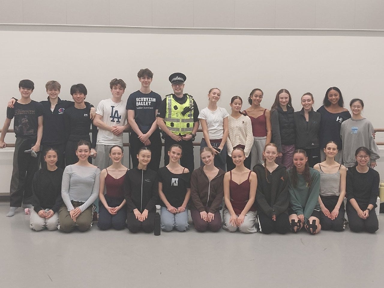 Image of police officer with students from the Royal Conservatoire of Scotland.