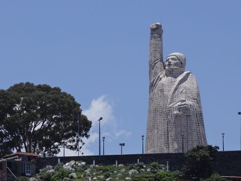 Images of dancing old men, the island by Patzcuaro, and the monument.