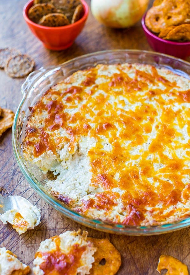 Creamy Baked Double Cheese and Sweet Onion Dip with bites missing. 