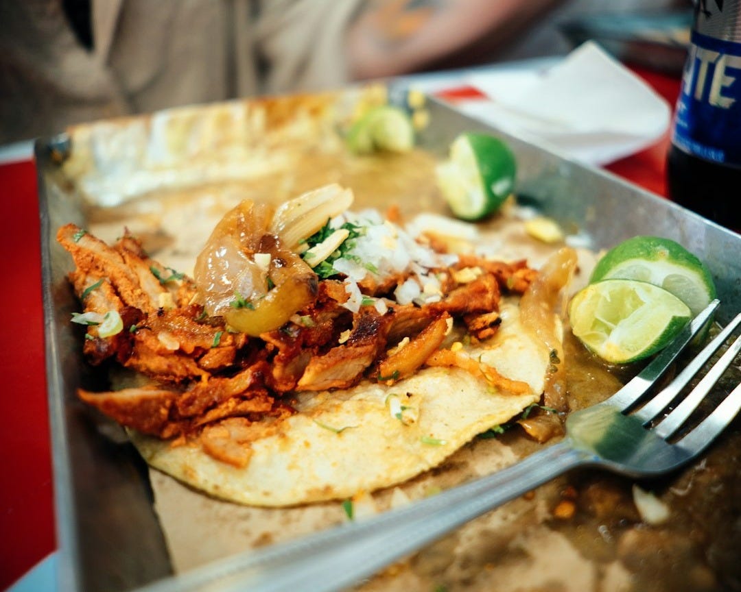 a close up of a plate of food with a fork