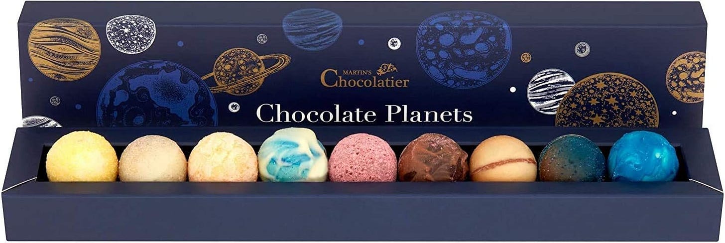 A box of chocolate planets by Martin's Chocolatier.