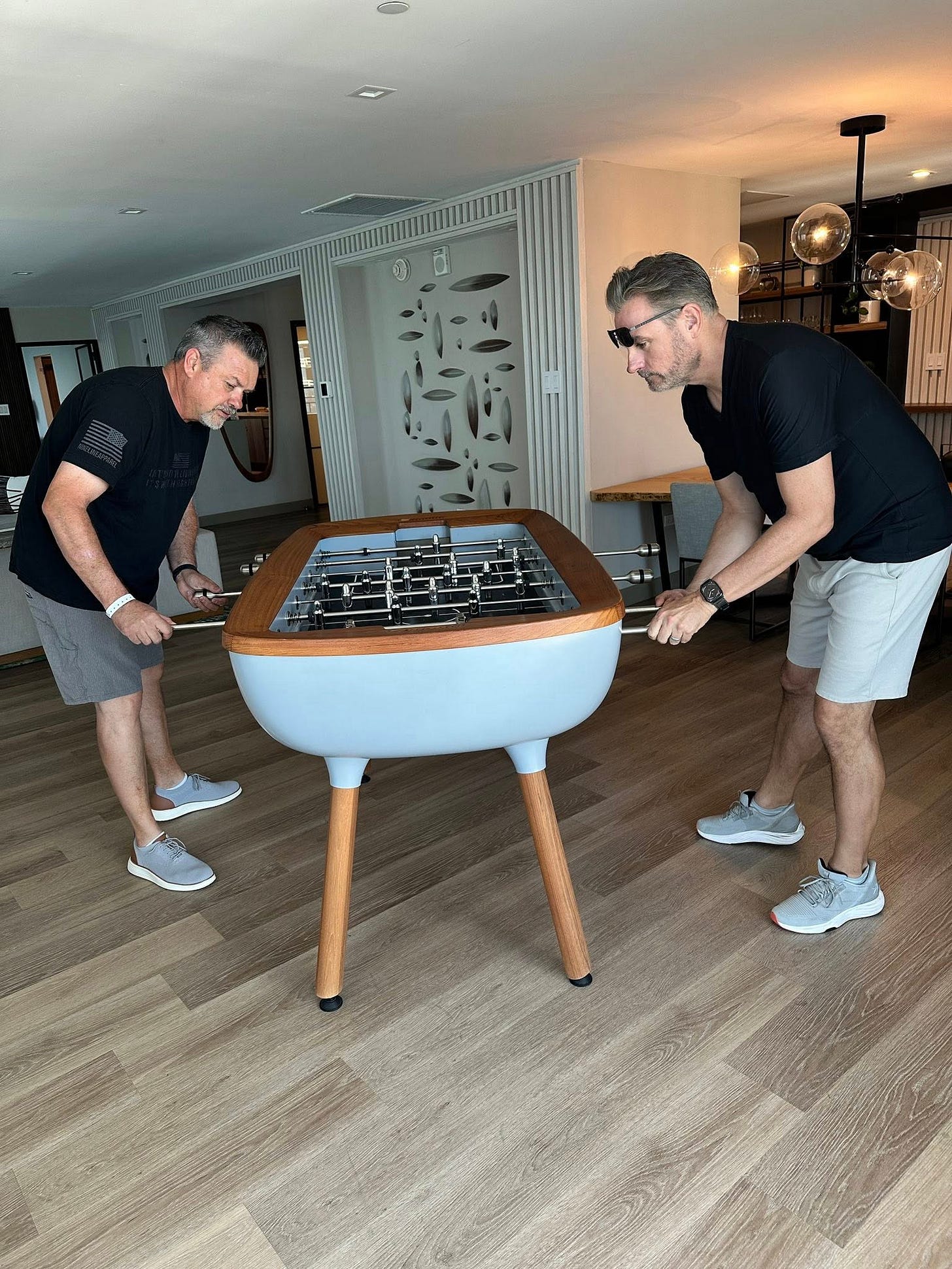 May be an image of billiards, indoors and text