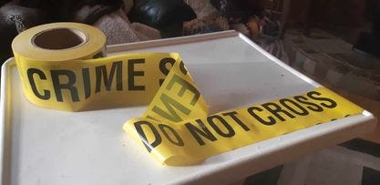 Roll of yellow CRIME SCENE DO NOT CROSS yellow tape Roll of yellow CRIME SCENE DO NOT CROSS yellow tape