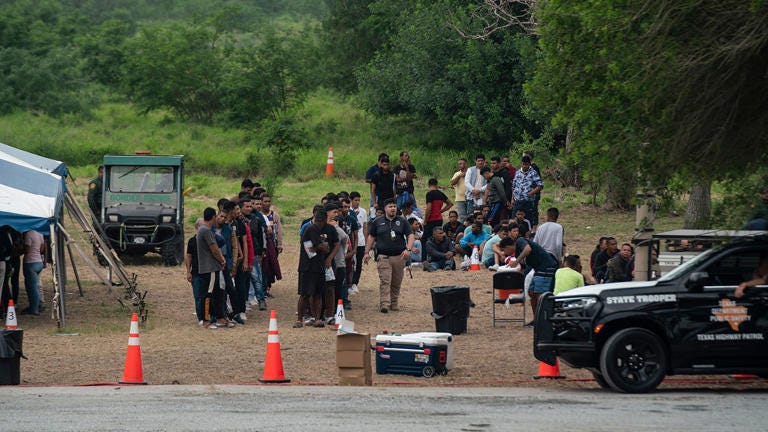 Migrants who recently crossed the border between the U.S. and Mexico are seen in Brownsville, Texas, Friday, May 5, 2023. Veronica G. Cardenas/AP
