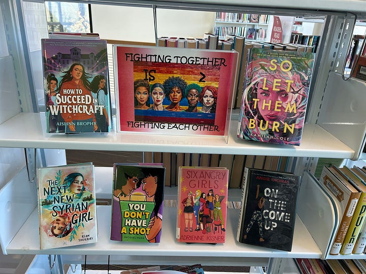 Displays of books including themes like "Black Joy," "Black Future Month," "Graphic Novel Black History Month," "All You Need Is Love?" and "Fighting Together Is Greater Than Fighting Each Other"