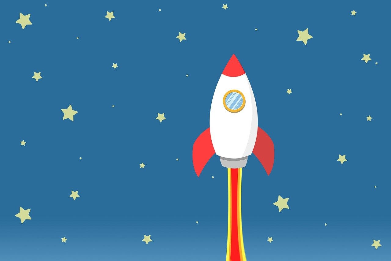 A cartoon image of a rocket going up on a blue starry background