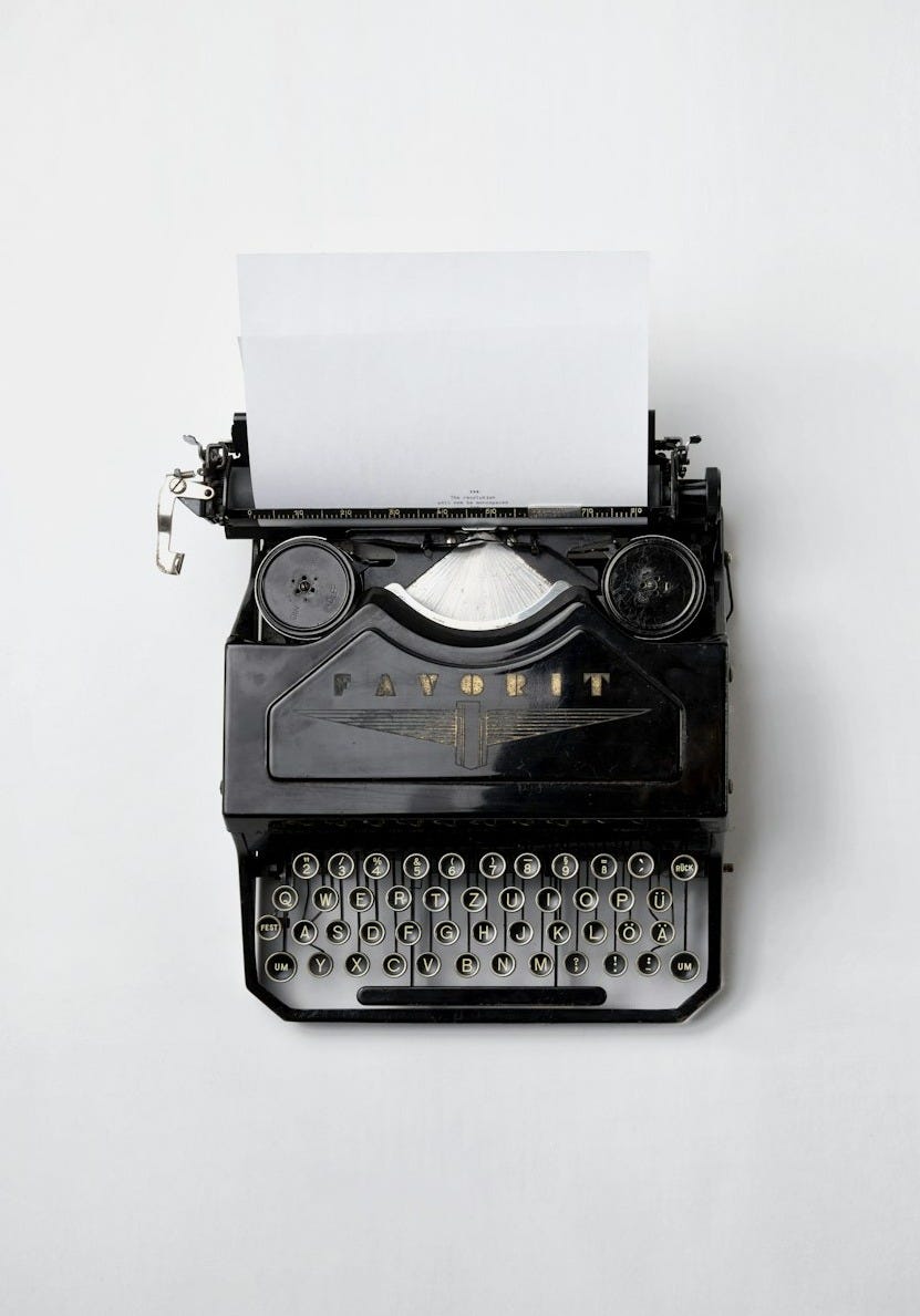 black Fayorit typewriter with printer paper black Fayorit typewriter with printer paper