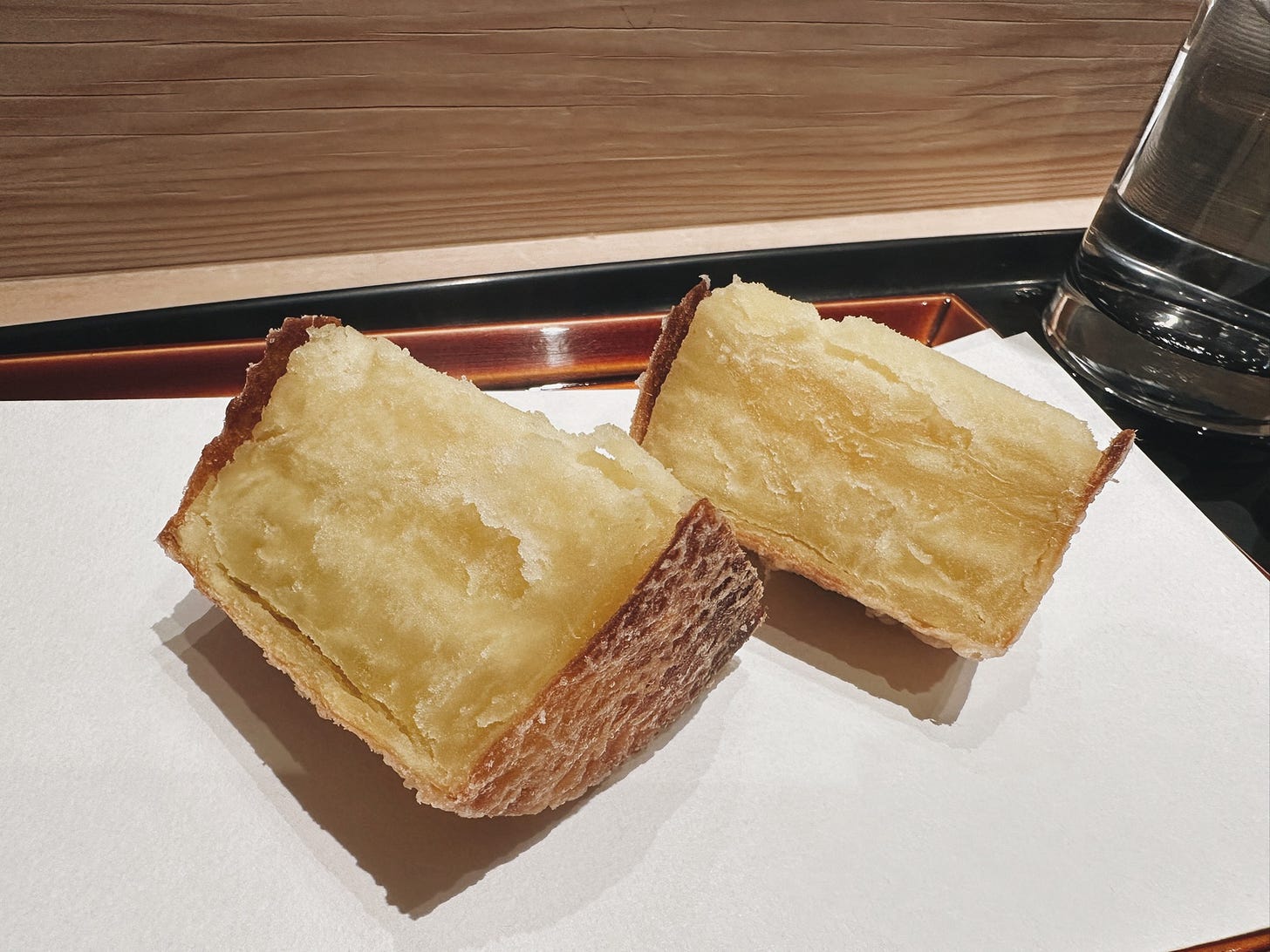 Lightly battered sweet potato at Tempura Kondo in Ginza, Tokyo. Lightly battered sweet potato at Tempura Kondo in Ginza, Tokyo.