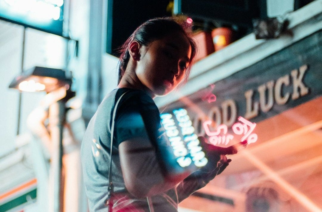 woman standing next to a store woman standing next to a store