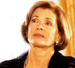 Lucille Bluth from Arrested Development slowing closing her eyes.