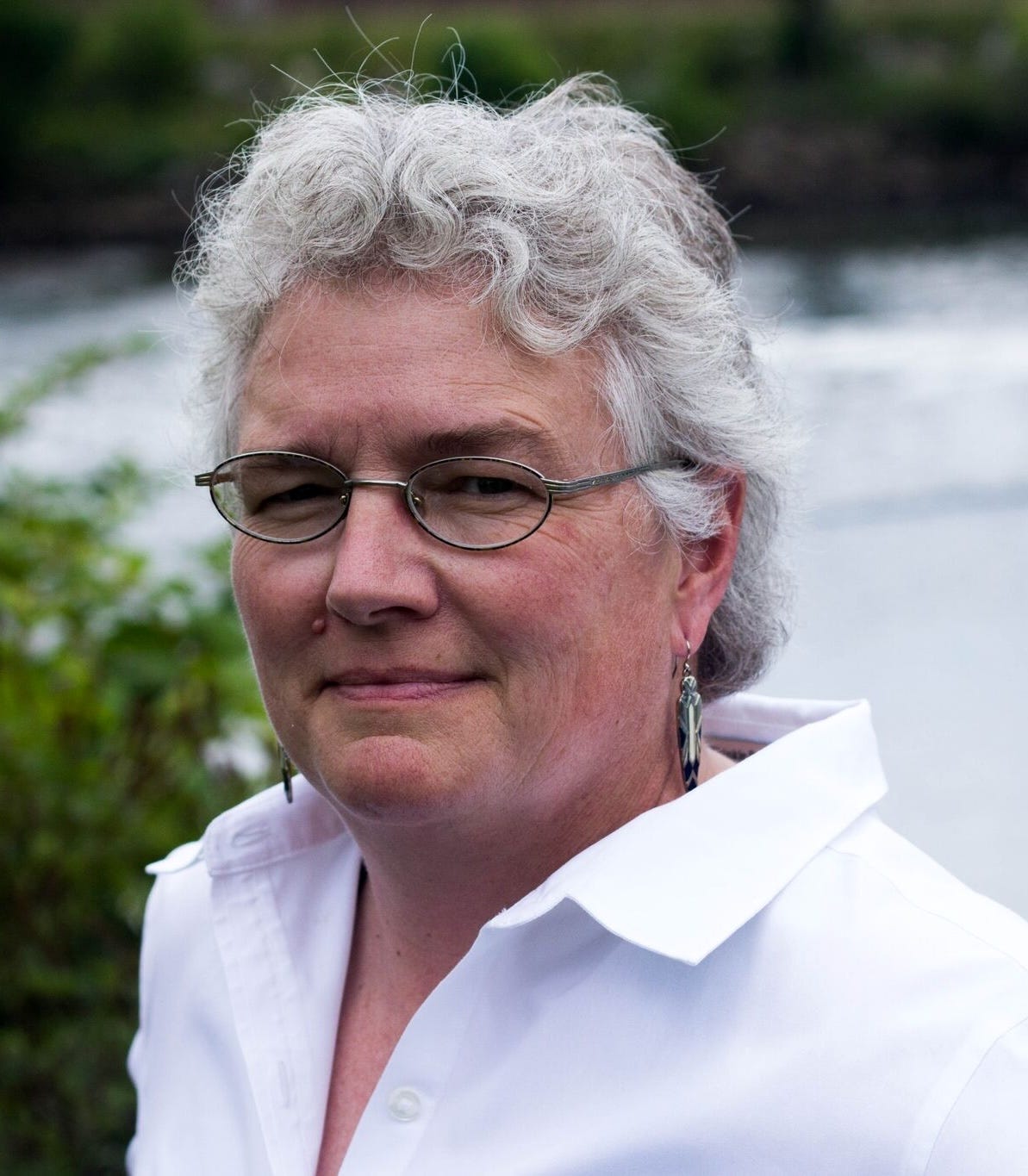 A head shot of Prison Radio's founder standing outside.