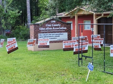 Several signs in front of a school
Description automatically generated Several signs in front of a school
Description automatically generated