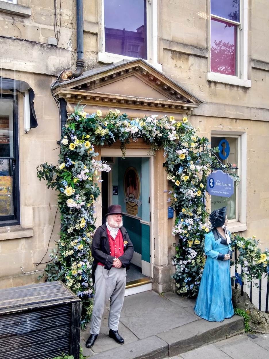 A person standing in front of a building with flowers
AI-generated content may be incorrect. A person standing in front of a building with flowers
AI-generated content may be incorrect.