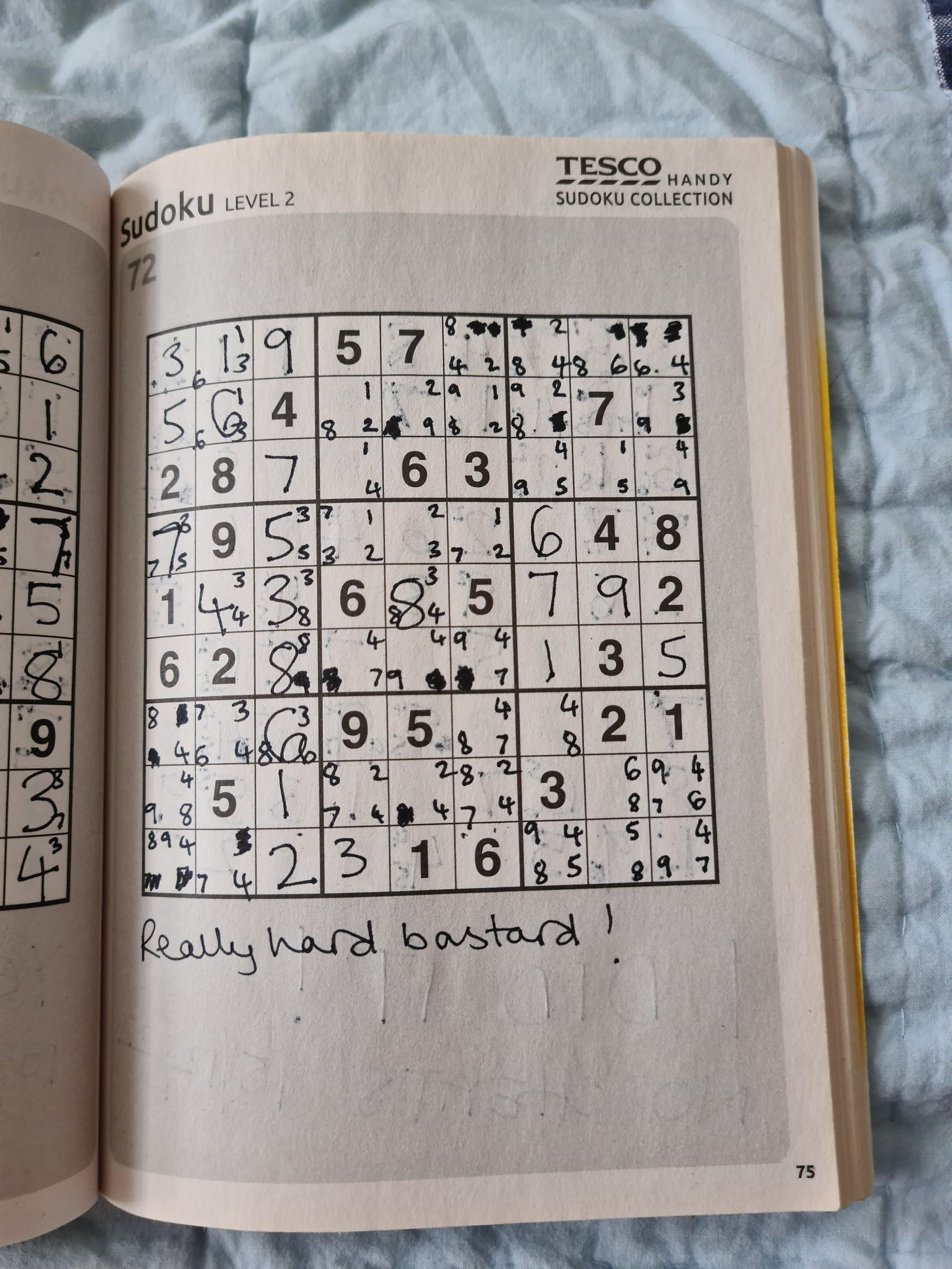 A Tesco SUDOKU puzzle book variously completed by our dad and then KV after his death.