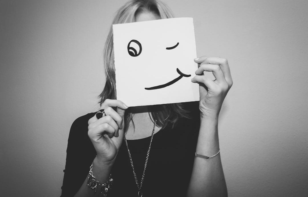 woman holding white printer paper