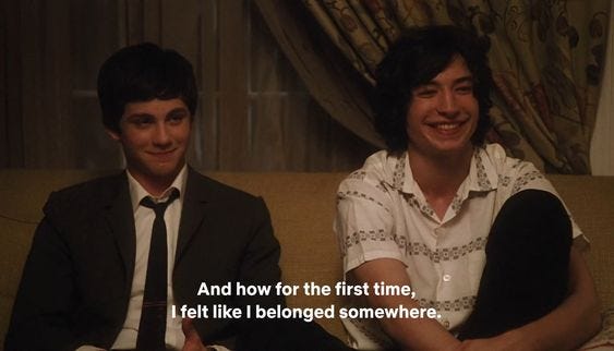 This may contain: two young men sitting on a couch next to each other with the caption'and how for the first time, i felt like i belong someone somewhere somewhere