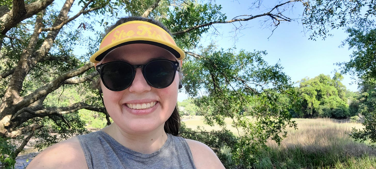 Sydney smiles on a short run in front the Charleston, SC, marsh on a sunny spring day.