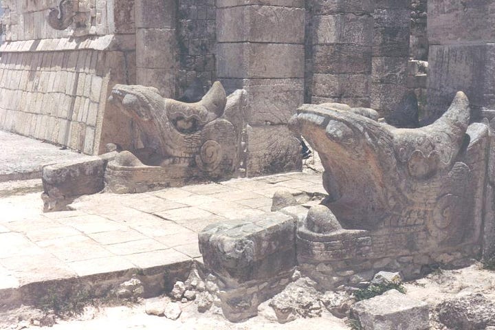 a chac mool and serpent columns on top of the Temple of the Warriors