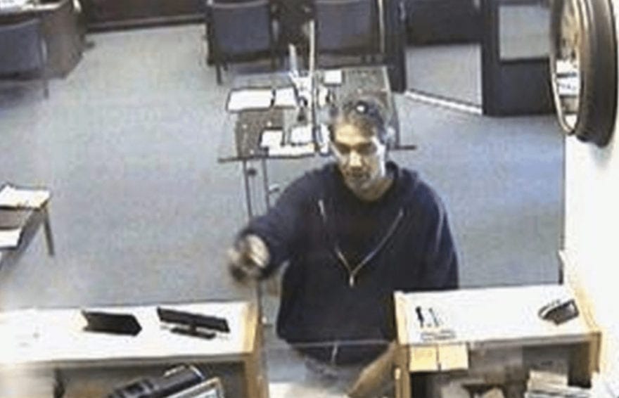 This is a freeze frame from a security camera capturing MacArthur robbing a bank in Pittsburgh in January 1995.