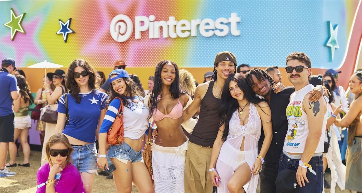 A group of young people stand before the Pinterest activation at Coachella 2026, a rainbow colored wall with the Pinterest logo A group of young people stand before the Pinterest activation at Coachella 2026, a rainbow colored wall with the Pinterest logo