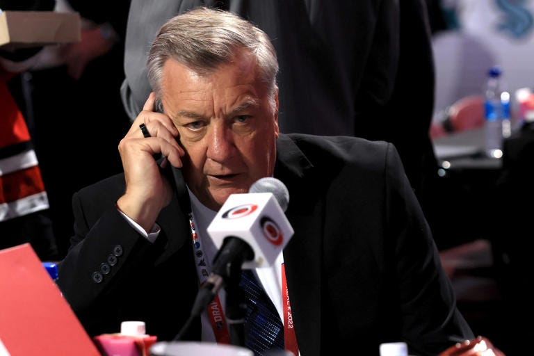 General manager Don Waddell of the Carolina Hurricanes prior to Round One of the 2022 Upper Deck NHL Draft making a call.