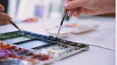 Images of watercolor paintings and painting in process by Katie White