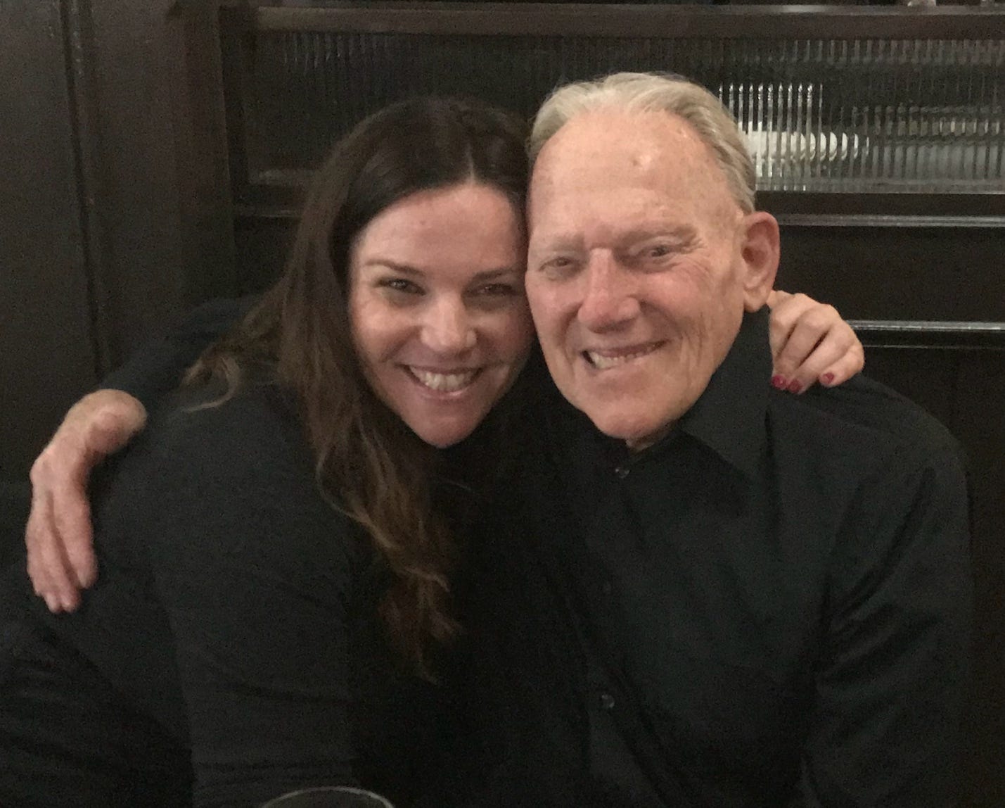 A person and person posing for a picture

AI-generated content may be incorrect.