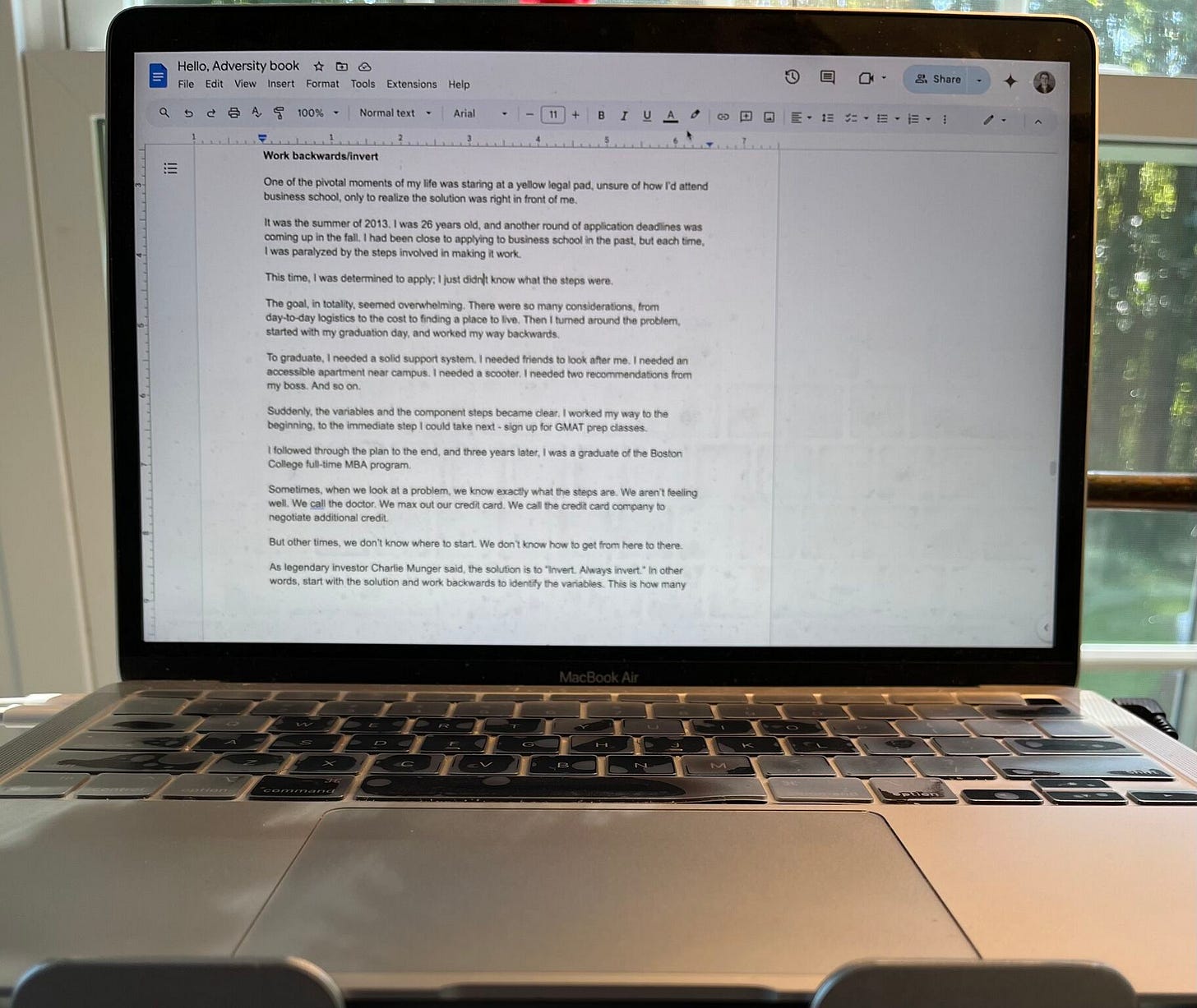 An open laptop with text in an open Google Doc.