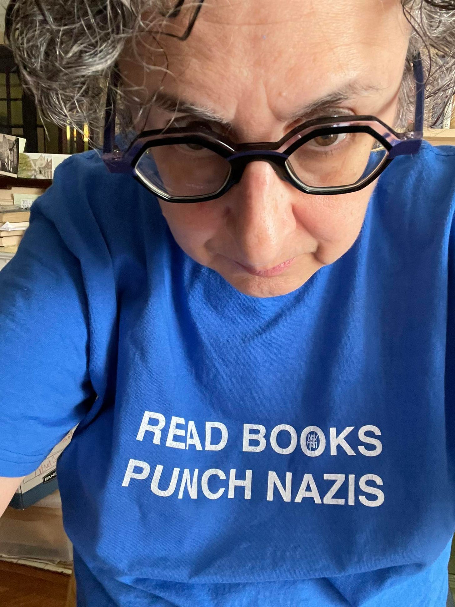May be an image of 1 person and text that says 'READ BOOKS PUNCH NAZIS' May be an image of 1 person and text that says 'READ BOOKS PUNCH NAZIS'