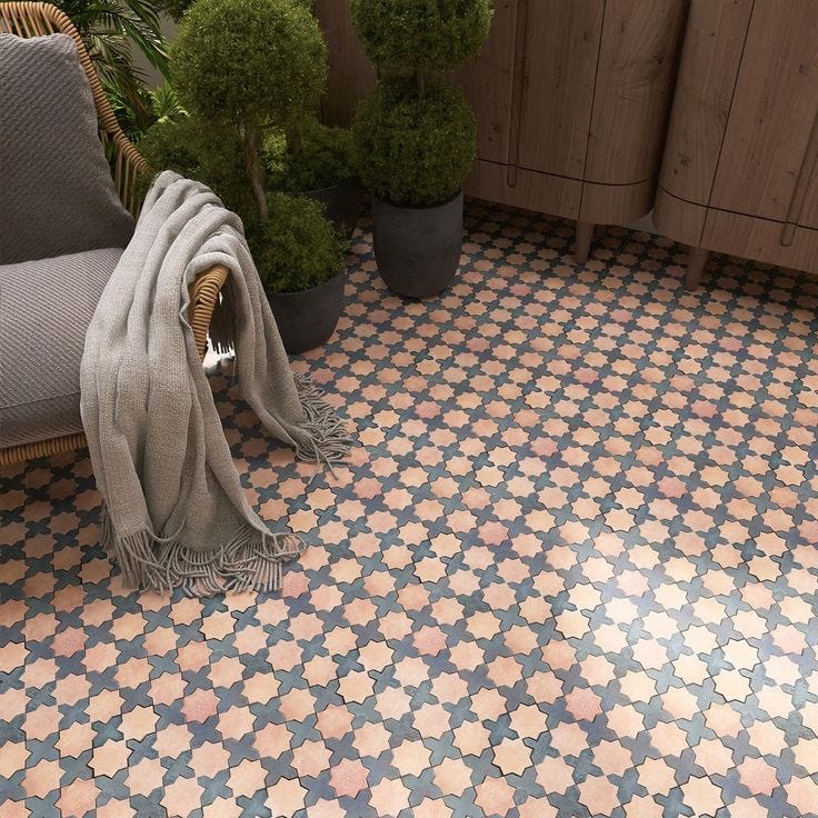 This may contain: a tiled floor with potted plants and a chair This may contain: a tiled floor with potted plants and a chair
