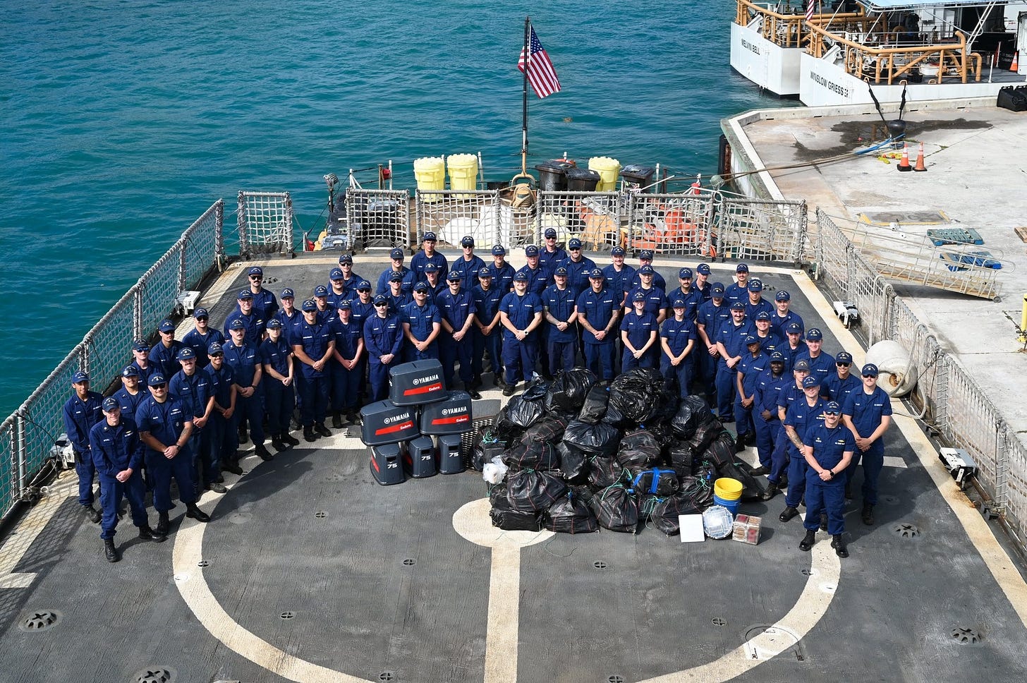 Crew of the US Coast Guard Cutter “Tampa” & the bales of cocaine they seized from smugglers during their recent Eastern Pacific Ocean patrol.