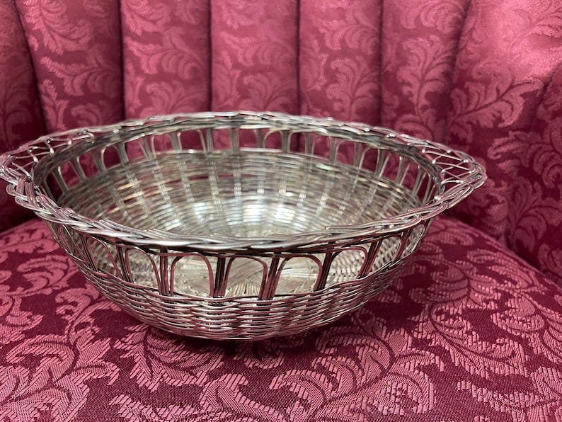 Vintage Mid Century Silver-Plated Wooven Metal Bread Basket/Fruit Bowl with handles.About 9.5”diameter and 3.5”deep.Great condition.Durable image 1