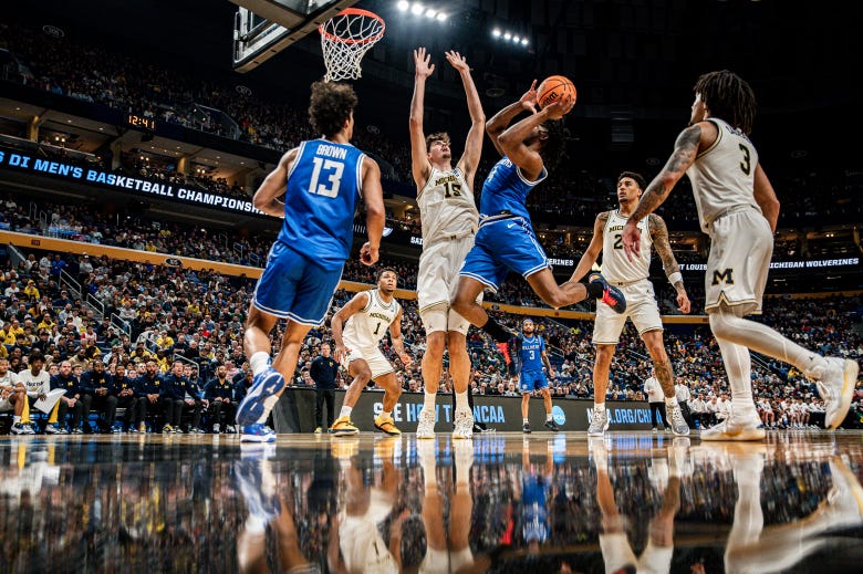 Aday Mara attempts to block the basketball.