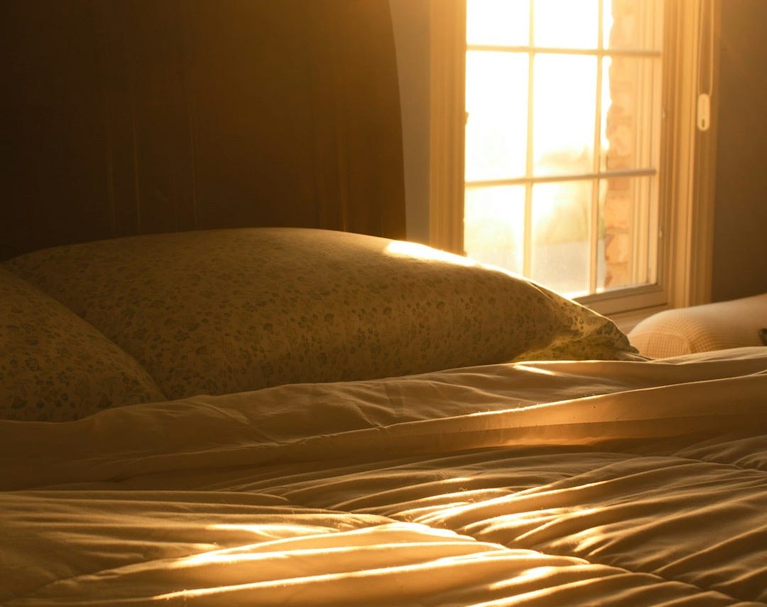 white and brown bed linen