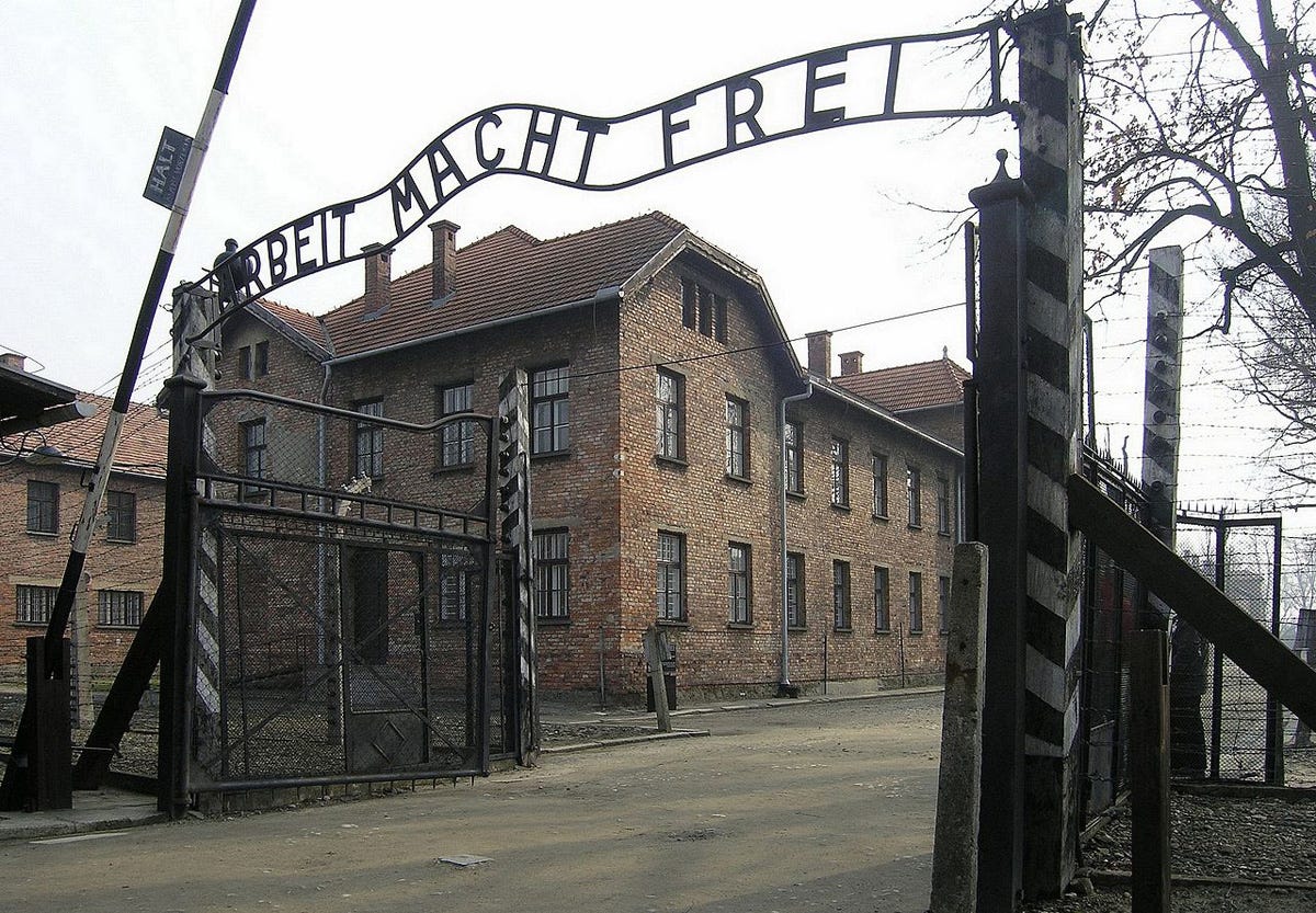The notorious barracks gate at Auschwitz II-Birkenau with the cynical Nazi  statement 'Arbeit macht frei', or 'Work shall set you free', in a  photograph from 2007. (photograph by Dnalor 01, Creative Commons
