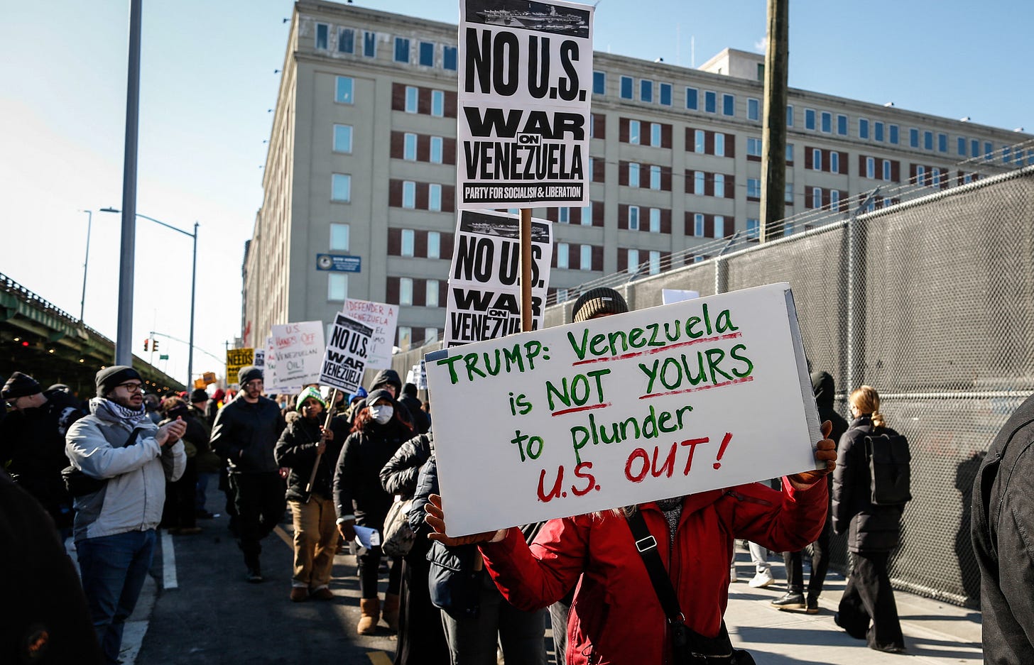 People take part in a demonstration against US military action in Venezuela outside the Metropolitan Detention Center, where ousted Venezuelan President Nicolas Maduro is being held. 