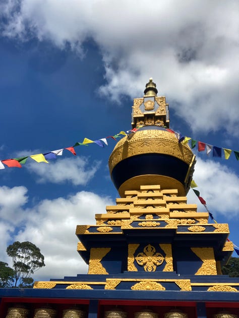 Six photos of an Asian temple, gardens, bamboo, buddha and prayer wheels.