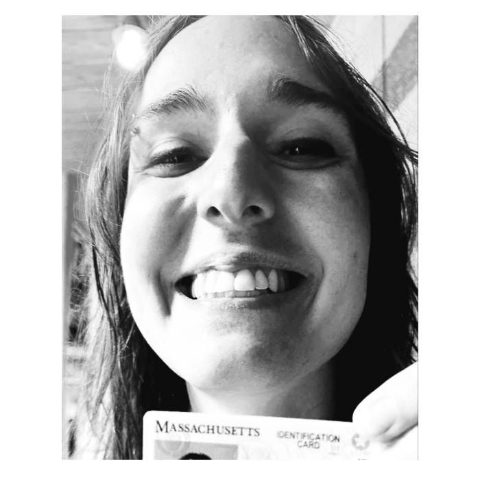30-year-old woman holds Massachusetts Real ID card 30-year-old woman holds Massachusetts Real ID card