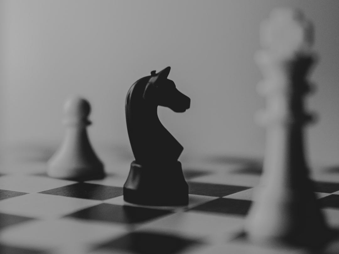 black horse chess piece near roque chess piece black horse chess piece near roque chess piece