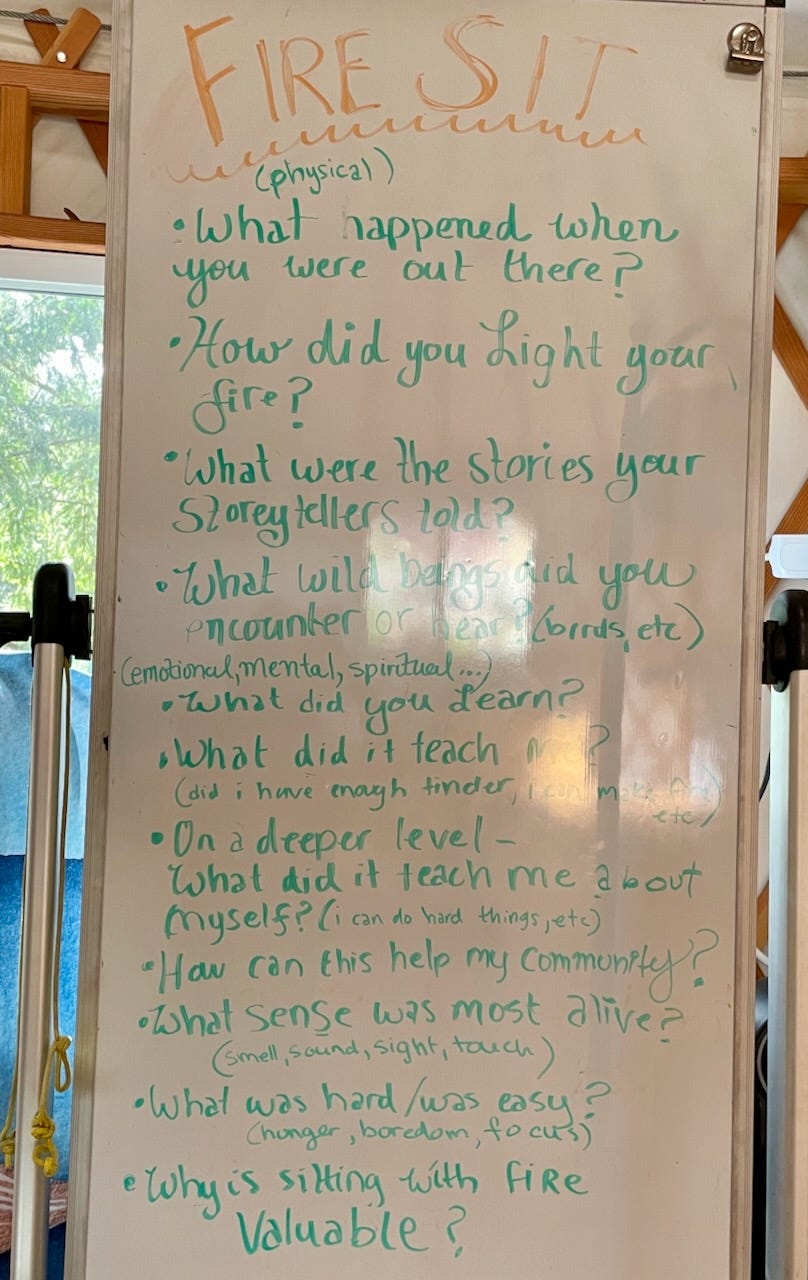 A whiteboard that reads "Fire" said: - What happened while you were out there? - What did you learn? - What stories did the storytellers tell you? - What did it teach me about myself? - How can this help my community? - What sense was the most alive? - What was hard or was easy? etc