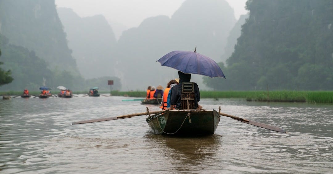 person riding on boat om water
