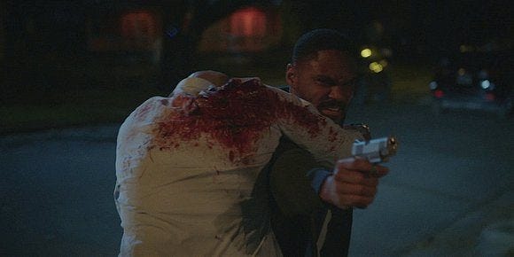 Trey running to return gunman's fire after finding James shot and bleeding on Walker. Trey running to return gunman's fire after finding James shot and bleeding on Walker.