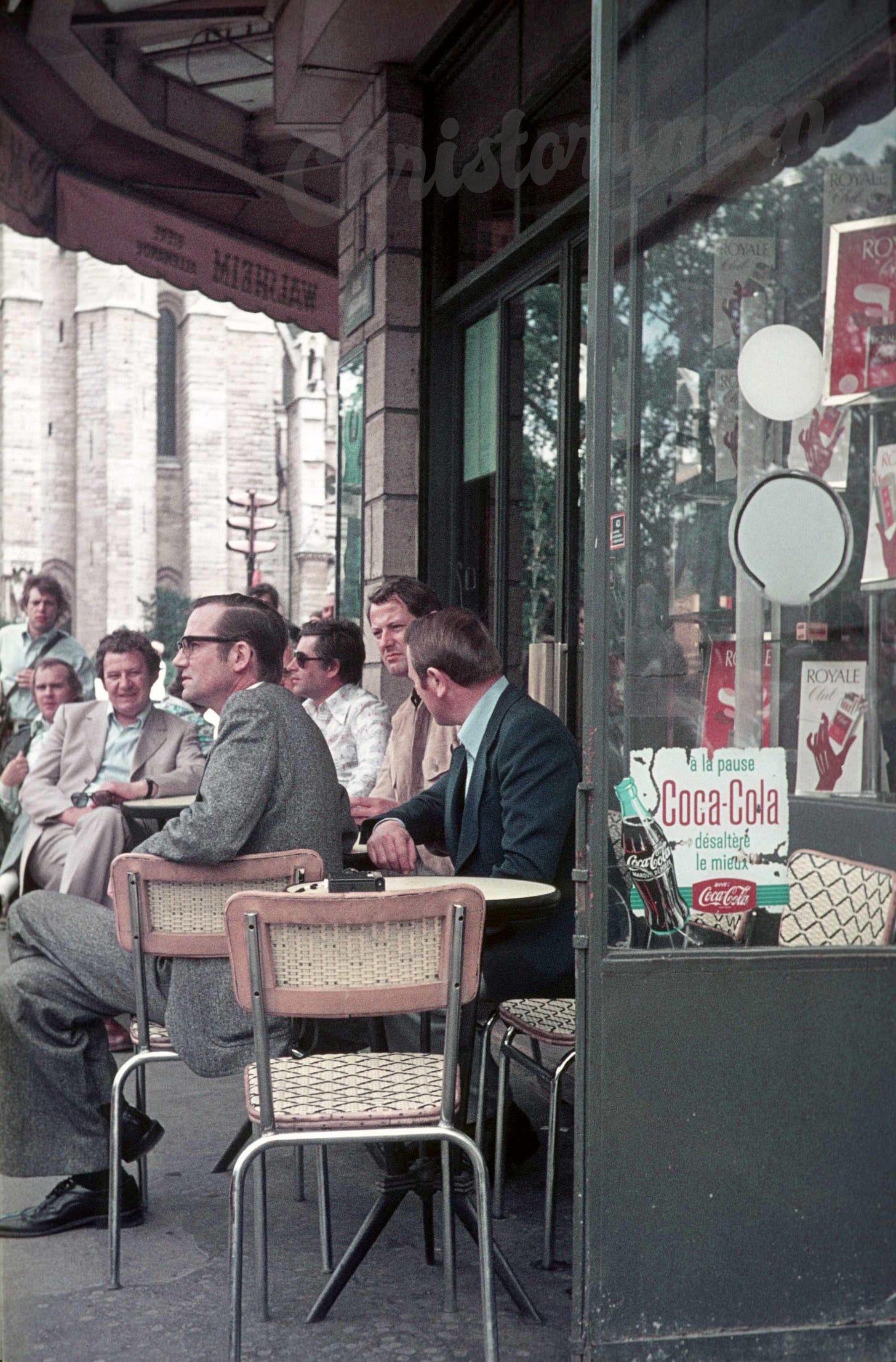 People relaxing in a street cafe in Paris, 1960s People relaxing in a street cafe in Paris, 1960s