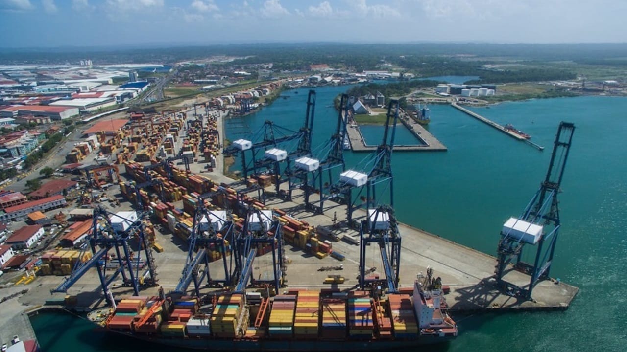 view of container terminal with blue cranes