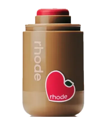 Product shot of the Rhode Pocket Blush in Candy Apple, a bright red cream blush stick with a limited edition apple sticker.