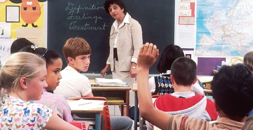 woman standing in front of children